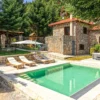Private pool, hot tub and stone house in the garden at Villa Mainalis