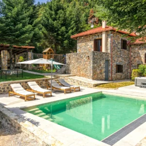 Private pool, hot tub and stone house in the garden at Villa Mainalis