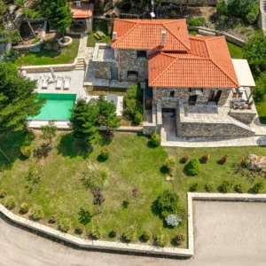 Aerial view of Villa Mainalis showing the house, pool, garden and surrounding grounds