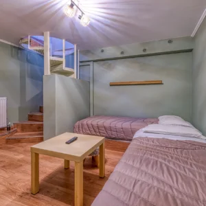 Bedroom 5 twin room with internal stairs connecting to Bedroom 2 at Villa Mainalis