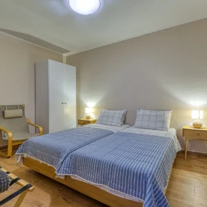 Bedroom 4 with a bed that can be arranged as a double or two singles at Villa Mainalis