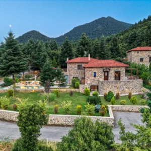 Villa Mainalis and its landscaped grounds in the forested Mount Mainalo setting