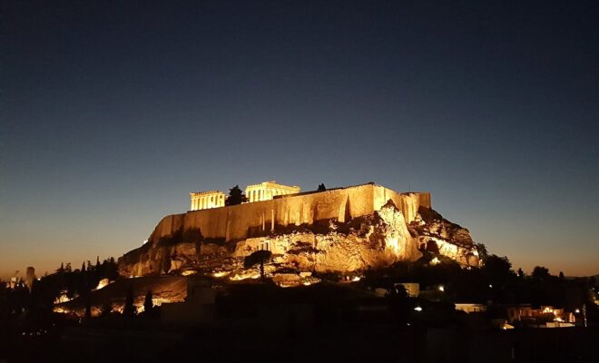 Athens by night — the Acropolis lit above the city
