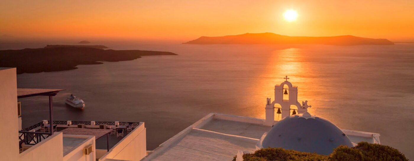 Cycladic islands — whitewashed cubes, blue shutters, the Aegean below