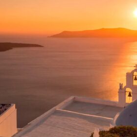Cycladic islands — whitewashed cubes, blue shutters, the Aegean below